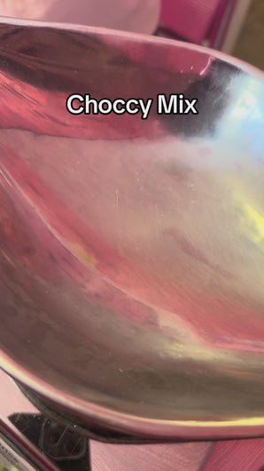video showing pouring of retro assortment of chocolate pick and mix 